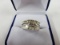 14KT WHITE GOLD AND DIAMOND RING CONTAINING