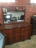 MAHOGANY DRESSER WITH MIRROR, SERPENTINE BASE WITH 12 DRAWERS