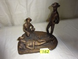 CAST METAL STATUE OF COWBOYS AROUND A CAMPFIRE