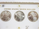 (3) MORGAN SILVER DOLLARS ENCAPSULATED IN DISPLAY, BU CONDITION -