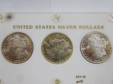 (3) MORGAN SILVER DOLLARS ENCAPSULATED IN DISPLAY, BU CONDITION -