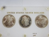 (3) MORGAN SILVER DOLLARS ENCAPSULATED IN DISPLAY, BU CONDITION -