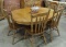 ROUND OAK DINING TABLE WITH 6 CHAIRS AND 2 LEAVES