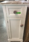 SMALL STORAGE UNIT WITH CUT STONE TOP AND TALAVERA DRAWER PULLS