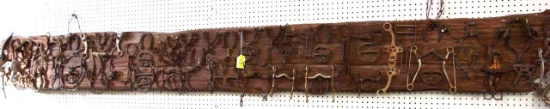 11 FT LONG BARNWOOD COVERED WITH ANTIQUE/VINTAGE SPURS, BITS AND HORSESHOES