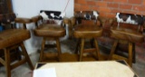 SET OF 4 WESTERN THEMED OAK BAR STOOLS WITH LEATHER SEATS AND COWHIDE BACKS