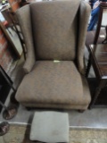 CUSTOM UPHOLSTERED WING BACK CHAIR AND ANTIQUE FOOTSTOOL