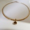 14KT YELLOW GOLD CHOKER WITH A GOLD AND SPINEL PENDANT (23G)