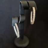 Pair of 14kt White gold and Diamond in & out Earrings containing 29 3mm diamonds @ 3.5 TCW