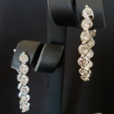 SPECTACULAR PAIR OF JYE 18KT WHITE GOLD AND DIAMOND IN AND OUT HOOP EARRINGS