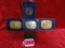 4 SMITH & WESSON BELT BUCKLES AND 1 TEXACO BUCKLE