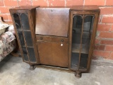 VINTAGE OAK SIDE BY SIDE GLASS BOOKCASE WITH A DROP FRONT DESK, CIRCA 1920