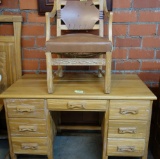 A BRANDT RANCH OAK KNEE HOLE DESK AND CHAIR