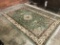 ORIENTAL RUG WITH GREEN GROUND, 5'6