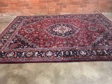 PERSIAN RUG MADE IN IRAN - RED GROUND WITH NAVY, 12.8' X 9.6'