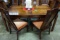 VINTAGE BERNHART SHIBUI EXTENDABLE DINING TABLE AND 8 CHAIRS.