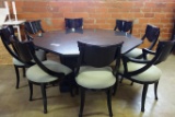 MID CENTURY BLACK GRANITE OCTAGON TABLE WITH 8 BLACK LAQUERED CHAIRS.