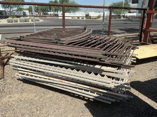 STACK OF ROD IRON FENCES PANELS & GATES