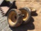 (4) CAT SKID STEER TIRES & WHEELS