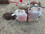 TRUCK TIRE CHAINS & (4) GAS CANS