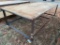 4'X8' STEEL TABLES W/ CASTORS & WOODEN TOPS