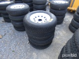 Set of Four Solid Skid Steer Tires and 8-Lug Wheels