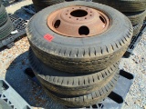Three 8.25R20 Tires and Wheels