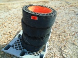 Four Solid Skid Steer Tires and 8-Lug Wheels