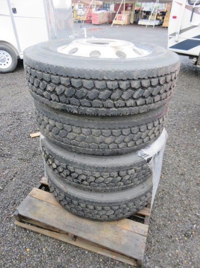 PALLET W/ (4) 295/75R22.5 TIRES ON ALUMINUM 10 LUG RIMS