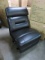 BLACK LEATHAIRE SECTIONAL ARMLESS RECLINER