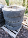 LOT OF 4 - 10.00-20 WHEELS AND TIRES