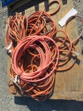 PALLET W/(3) ROLLS OF COMMERCIAL EXTENSION CORD & (1) ROLL OF AIR HOSE