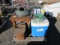 COOLER, TABLE, WICKER-BASKET, PANASONIC MICROWAVE, GARDEN HOSE, & PLASTIC STORAGE BINS