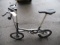 JAUNTY FOLDING BICYCLE, CARBON FIBER, BELT DRIVE, LED LIGHT, DISC BRAKES, CHARCOAL COLOR WITH STAND