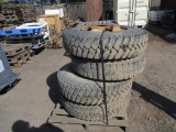 (4) 10.00-20 TIRES ON 10-LUG STEEL WHEELS