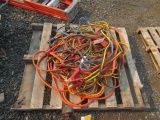 PALLET W/ ASSORTED EXTENSION CORDS & JUMPER CABLES
