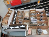 CONTENTS OF SHELF - ASSORTED PUMP COUPLERS