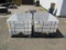 (2) POLY TANKS IN METAL CRATES W/ THE TOPS CUT OFF