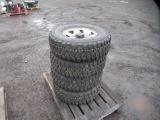 (4) STUDDED WILD COUNTRY TIRES