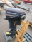 EVINRUDE E15ELE1A 15HP BOAT MOTOR ON A WOOD STAND