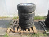 (4) BRIDGESTONE 275/55R20 TIRES ON DODGE 5 LUG ALUMINUM WHEELS