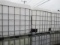 (6) IBC LIQUID STORAGE POLY TANKS W/ METAL BASKETS