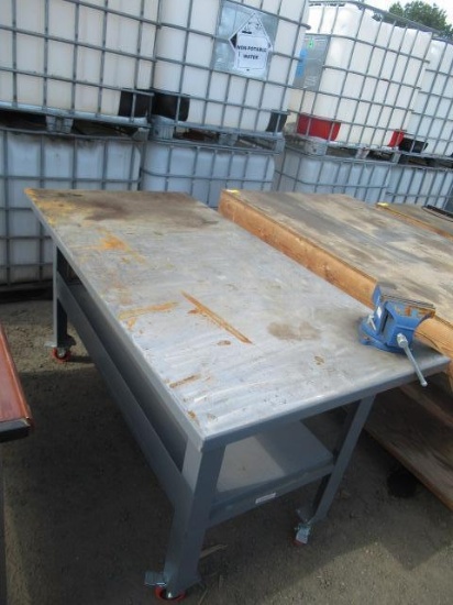 **PULLED** 6' X 3' X 38'' STEEL WORK TABLE ON CASTERS W/ 6'' BENCH VISE