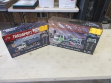 SINO REMOTE CONTROL TRANSPORT TRUCK W/ EXCAVATOR & TRANSPORT TRUCK W/ CONTAINER (UNUSED)