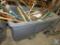 Portable fiberglass bin with brooms and shovels