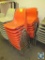 Orange poly stacking chairs