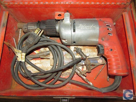 Milwaukee corded electric drill with toolbox and drill bits