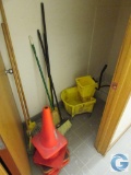 Quantity (6) cones, (4) brooms, (2) mops, and (1) fiberglass mop bucket