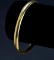 ITEM 87: 14kt. DOMED AND POLISHED BANGLE