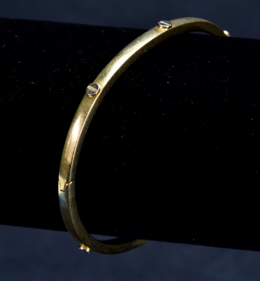 ITEM 84: 14kt. Y. GOLD BANGLE W/ WHITE GOLD MOTIFS